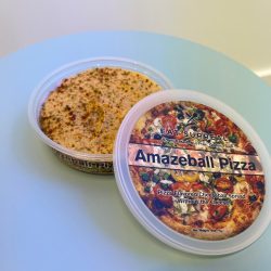 Pizza Amazeball Spread vegan pizza cheeseball alternative with tomato, banana peppers, and pepperoncini topping